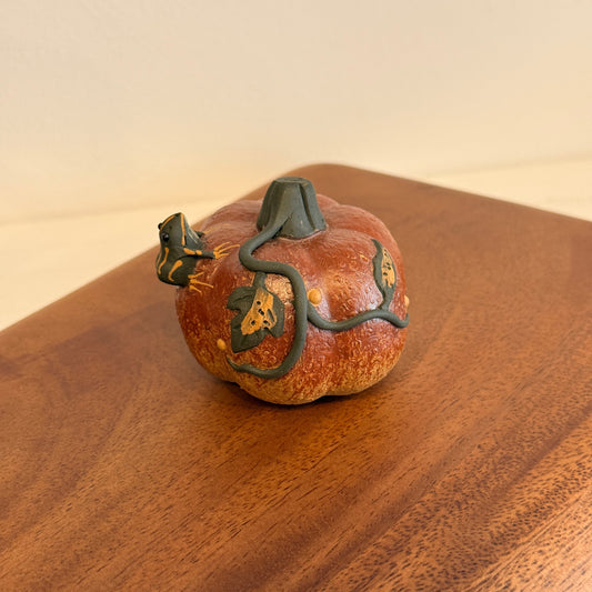 Frog on the pumpkin, spitting water